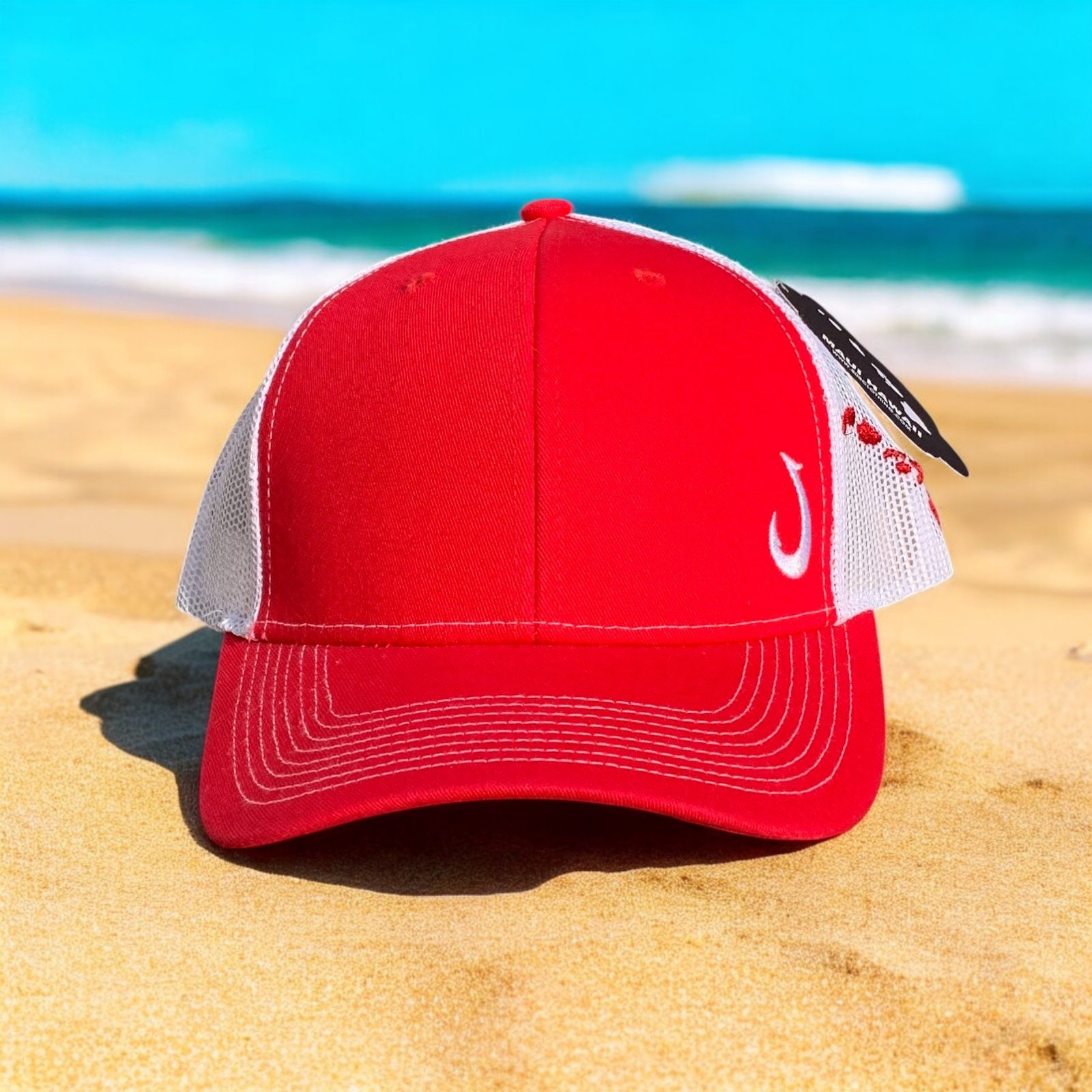 Vibrant Red and white snap back hat with embroidered Fishhook Makau and Hawaiian Islands